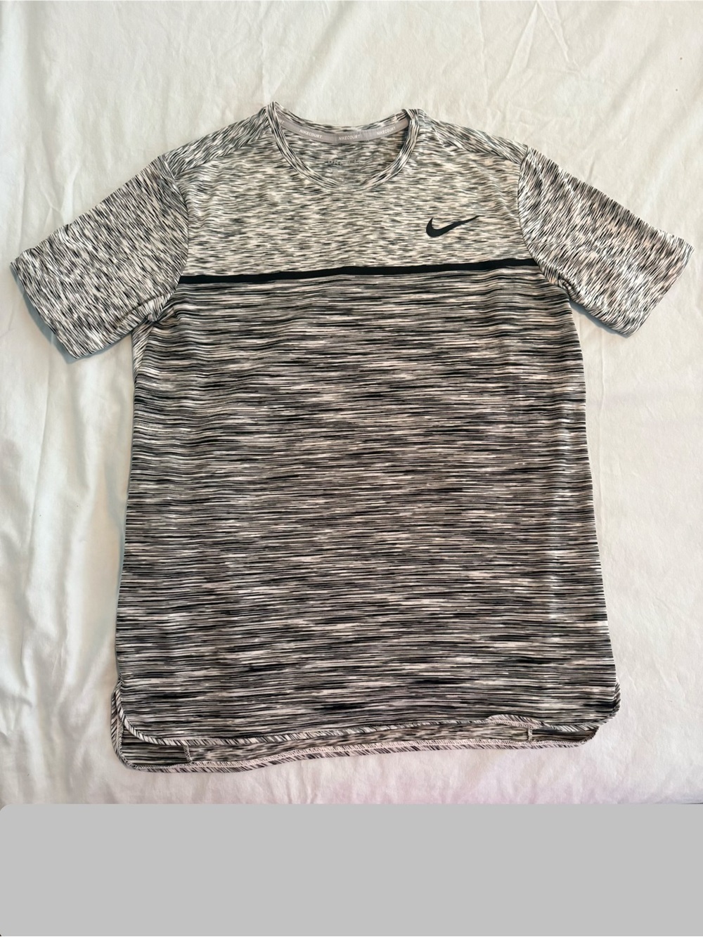 Men’s Nike Dri-Fit shirt size M
Black and white heather print  N13